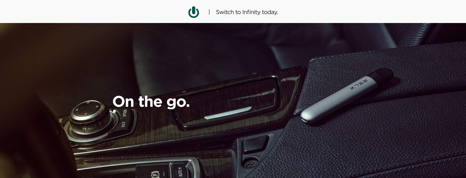 RELX Infinity Device lying in car interior - RELX on the Go